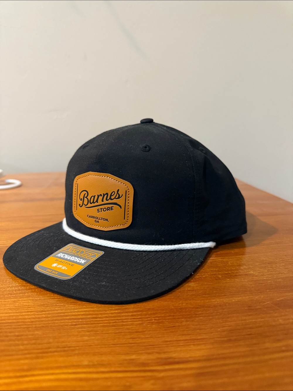 Black Snapback Hat with Tan Patch and White Rope